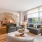 open living concept showing living room and kitchen combined with ample space for seating and modern living room decor